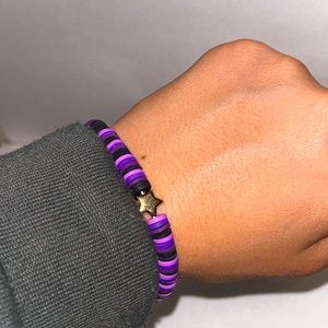 Clay Bead, Purple and Black with a Golden Star Charm